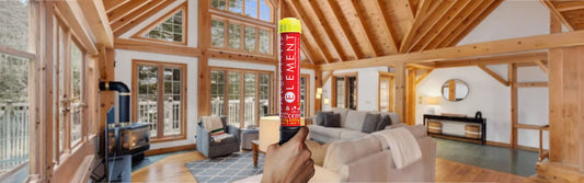 Element Fire Extinguisher Being held up in the living room of a charming cottage.